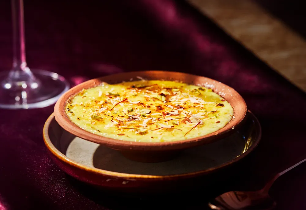 Saffron dessert in a clay bowl, shot by SBL Media